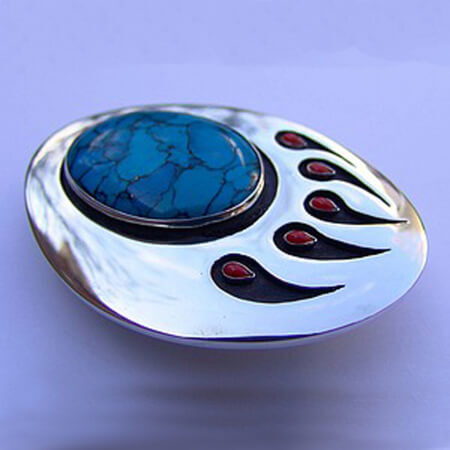 Gidoodeminaanig, our blood relations, bear paw belt buckle